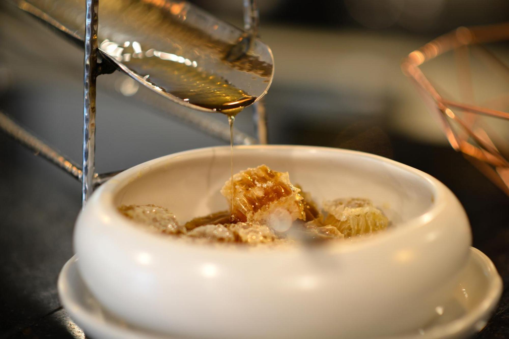 Villa De Pranakorn Bangkok Exterior photo Honeycomb being drizzled with honey